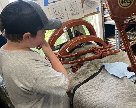 Ryker inspecting newly painted parts.